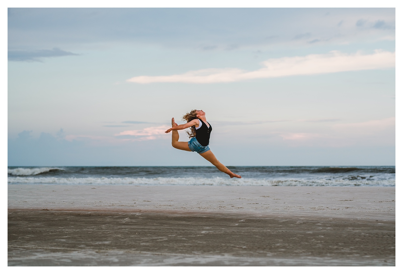 Dance jumping senior on the beach for senior portraits. Shelly Williams Photography