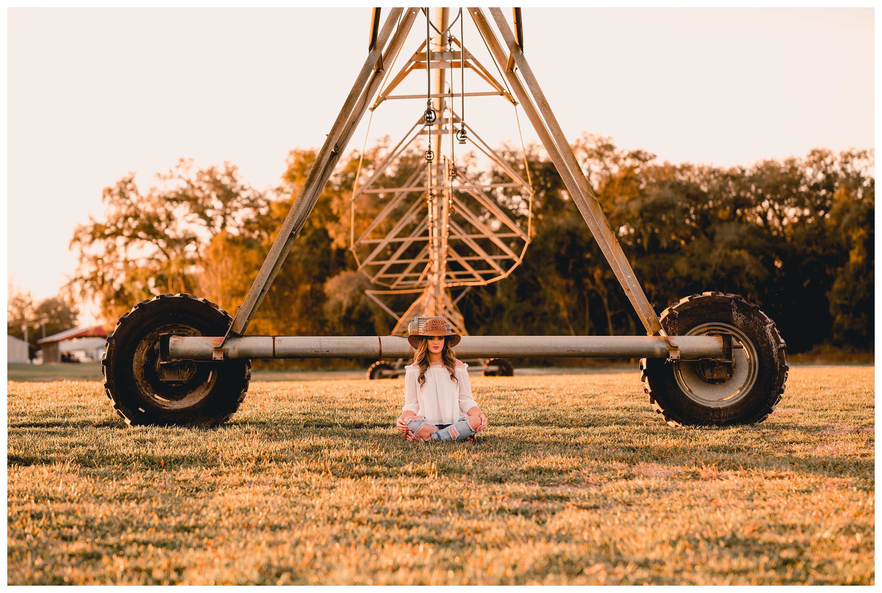 Irrigation system and symmetric senior picture in North Florida on a family farm. Shelly Williams Photography