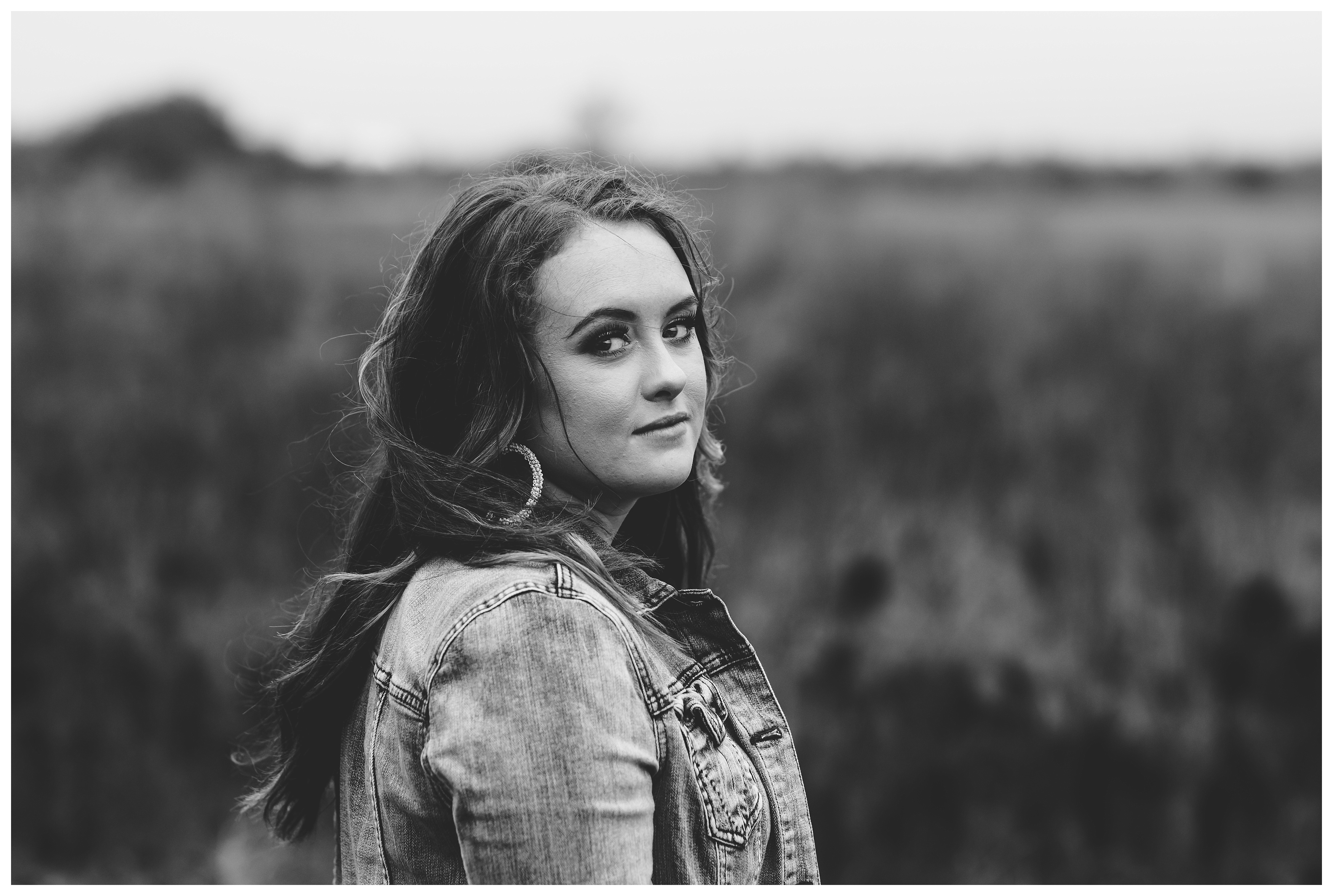 Black and white moody close up photo of high school senior. Shelly Williams Photography