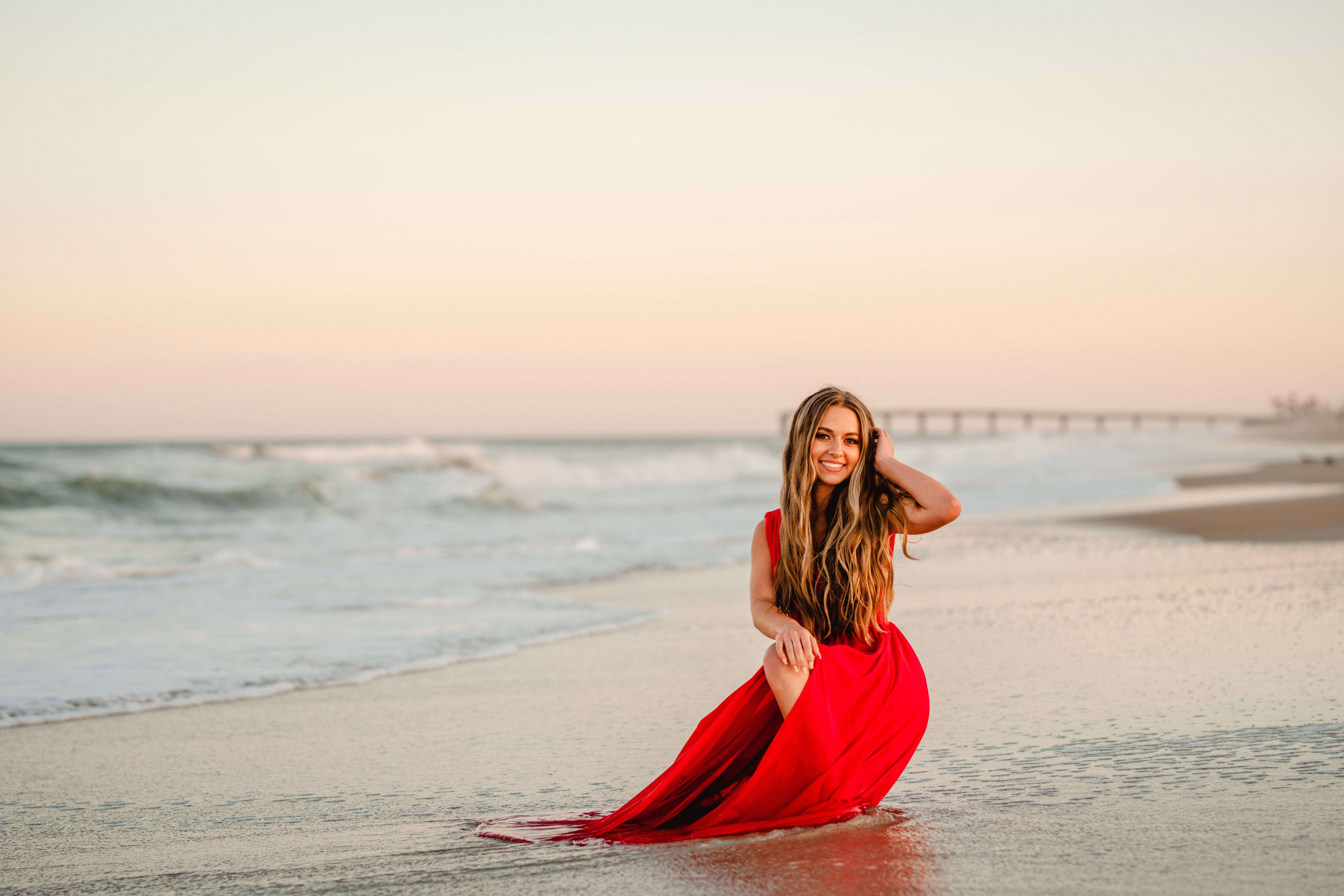 Hayley c/o 2022 // Senior pictures on the beach in red dress in St Augustine beach // North Florida Senior Photographer